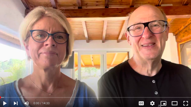 man-woman-smiling-talking-to-camera